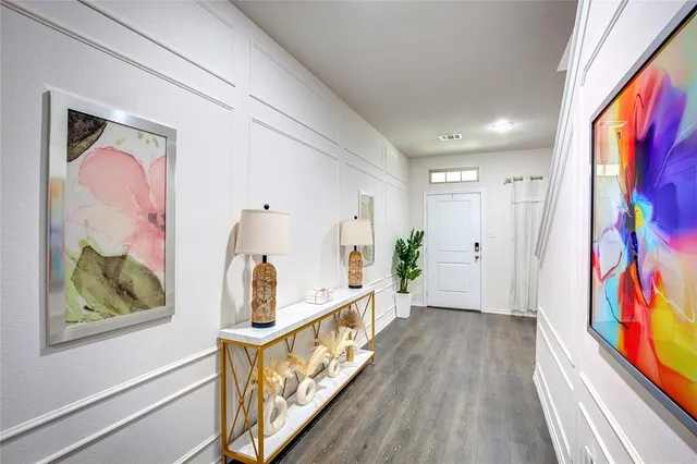 a dining room with furniture and wooden floor