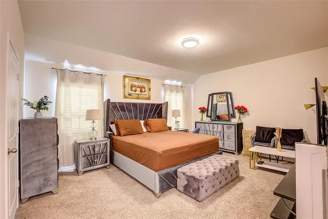 a view of an entryway with furniture wooden floor and windows