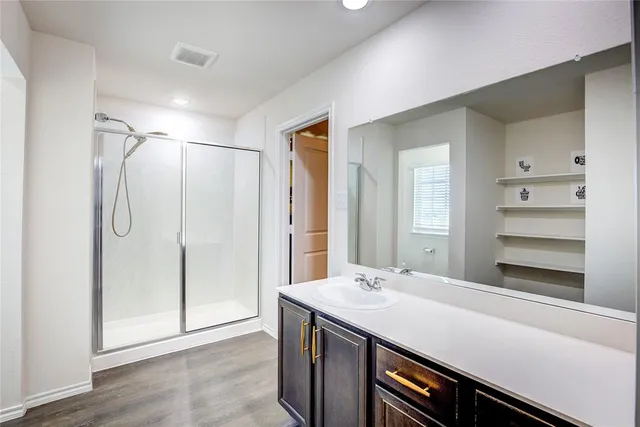 a bedroom with a bed and chair