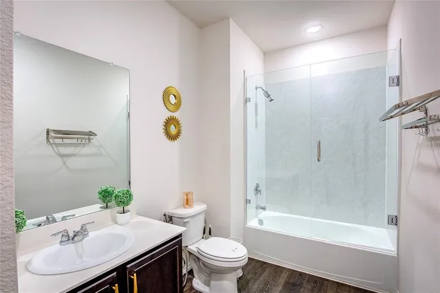 a bedroom with a bed and painting on the wall