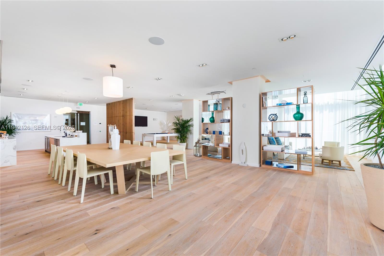 401 North Birch Road, Unit 701 Fort Lauderdale, FL 33304 - Photo 14 of 75 a view of a dining room with furniture window and wooden floor