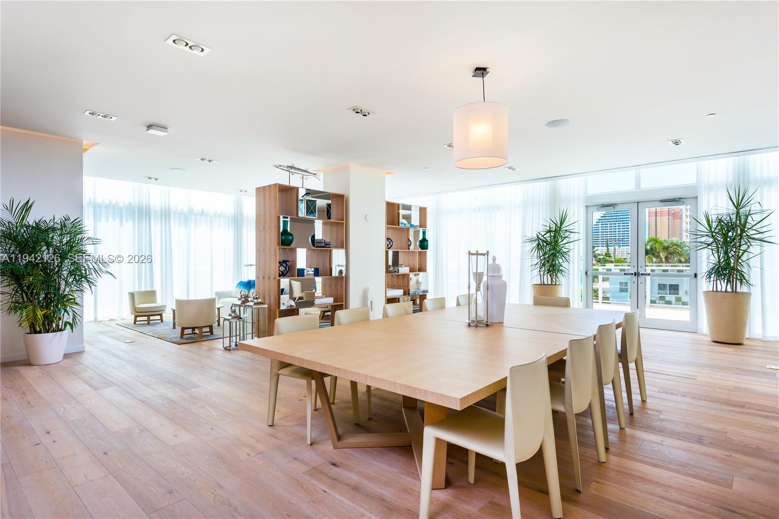 401 North Birch Road, Unit 701 Fort Lauderdale, FL 33304 - Photo 15 of 75 a view of a dining room with furniture window and wooden floor
