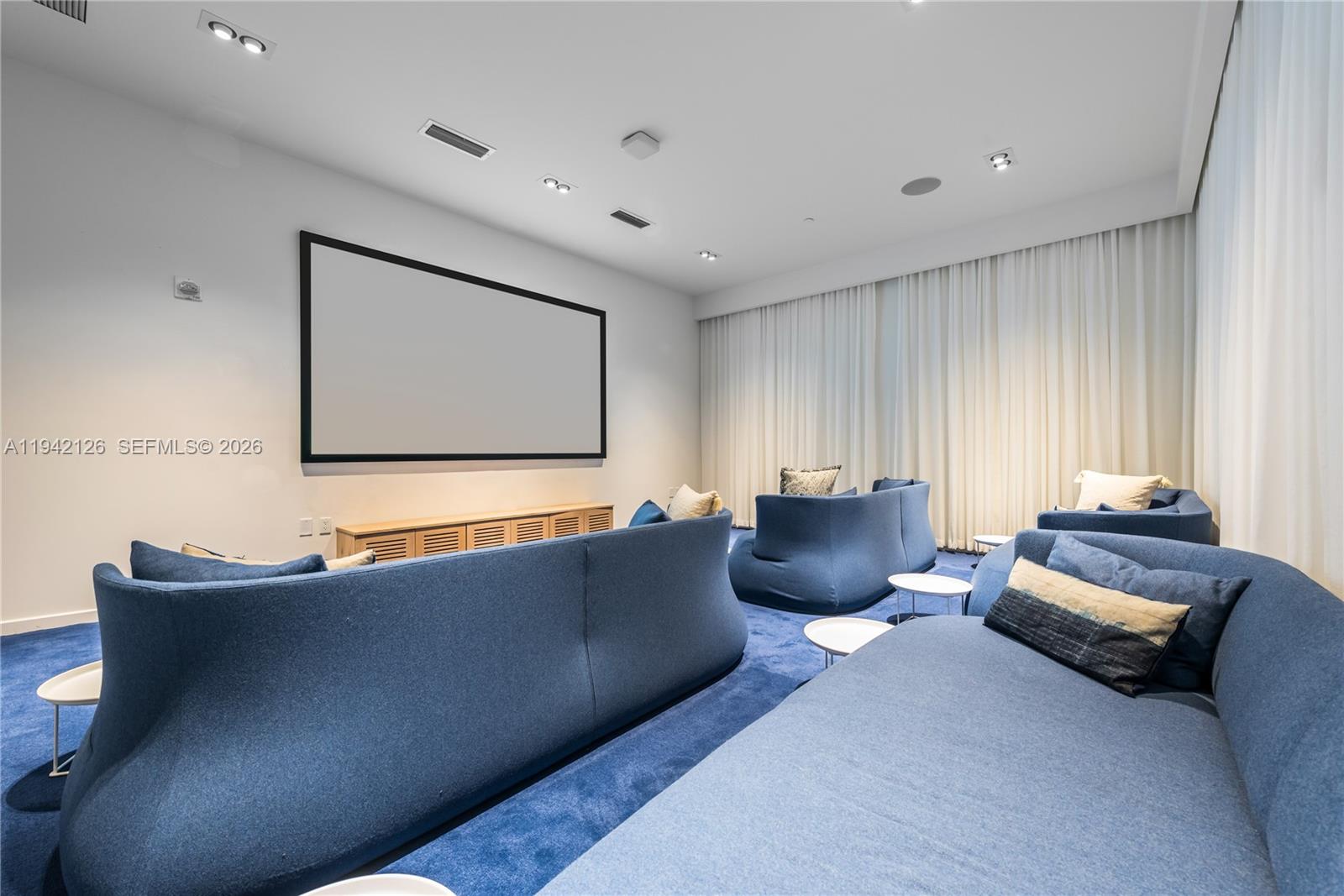 401 North Birch Road, Unit 701 Fort Lauderdale, FL 33304 - Photo 21 of 75 a living room with furniture and a flat screen tv