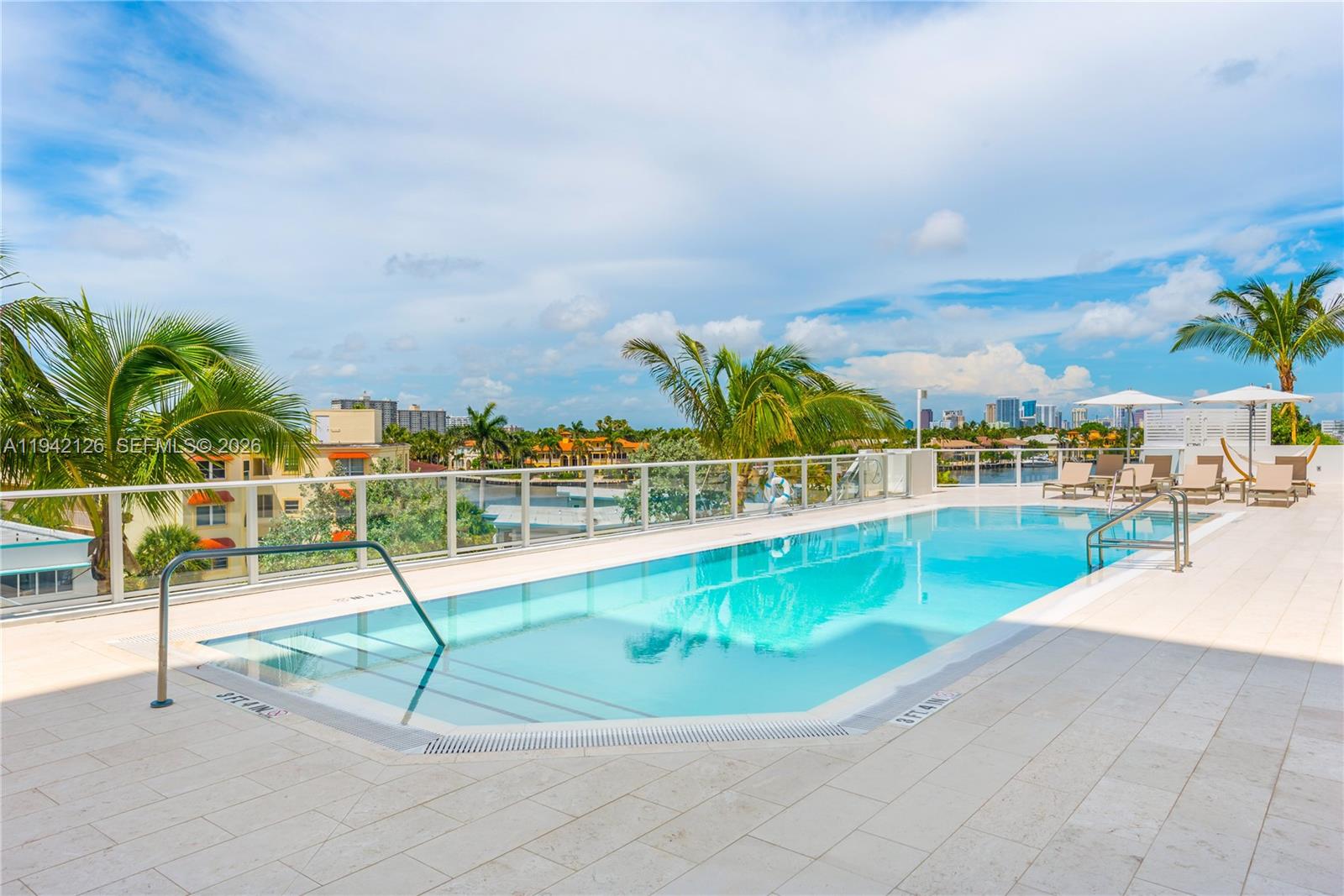 401 North Birch Road, Unit 701 Fort Lauderdale, FL 33304 - Photo 38 of 75 a view of a swimming pool with an outdoor seating