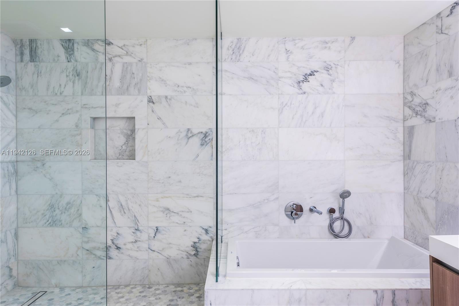 401 North Birch Road, Unit 701 Fort Lauderdale, FL 33304 - Photo 9 of 75 a bathroom with a bathtub and shower