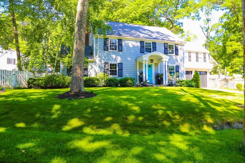15 Woodridge Road Wellesley, MA 02482 - Photo 1 of 36 a front view of a house with garden