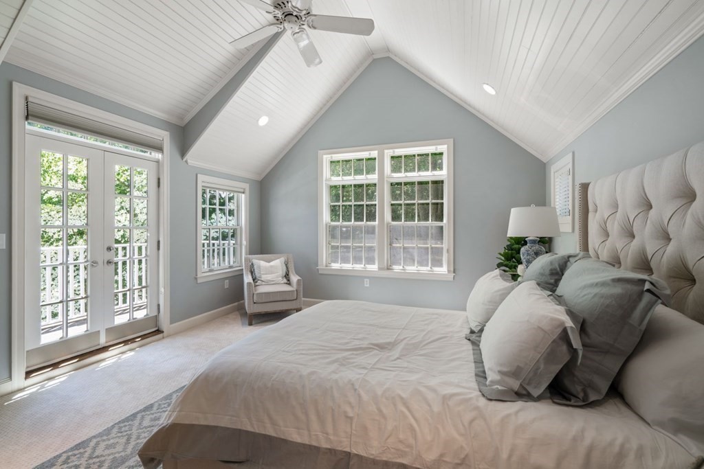 15 Woodridge Road Wellesley, MA 02482 - Photo 18 of 36 a bedroom with a large bed and a large window