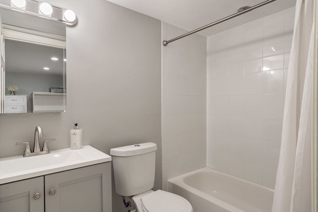 15 Woodridge Road Wellesley, MA 02482 - Photo 30 of 36 a bathroom with a sink toilet and shower