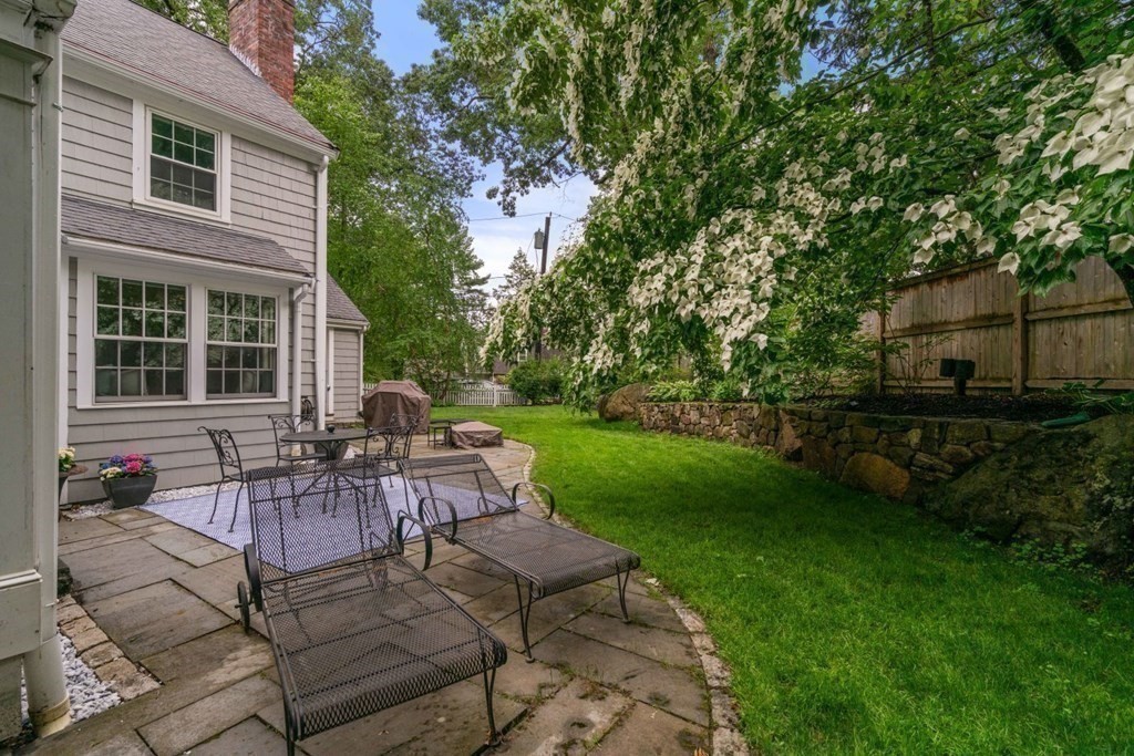 15 Woodridge Road Wellesley, MA 02482 - Photo 33 of 36 a view of a house with backyard sitting area and garden