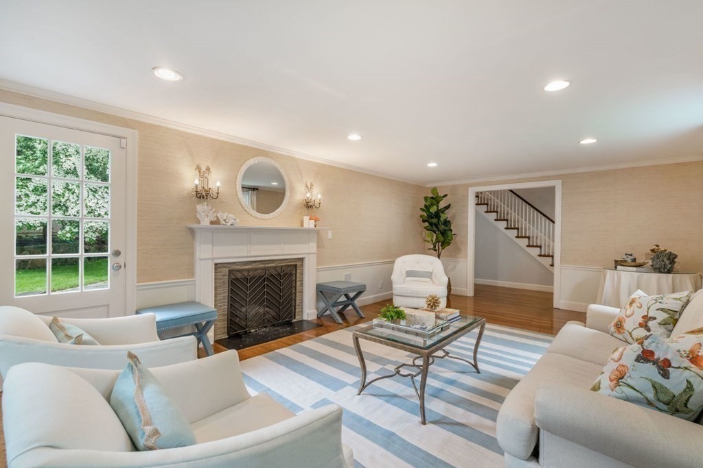 15 Woodridge Road Wellesley, MA 02482 - Photo 7 of 36 a living room with furniture and a fireplace
