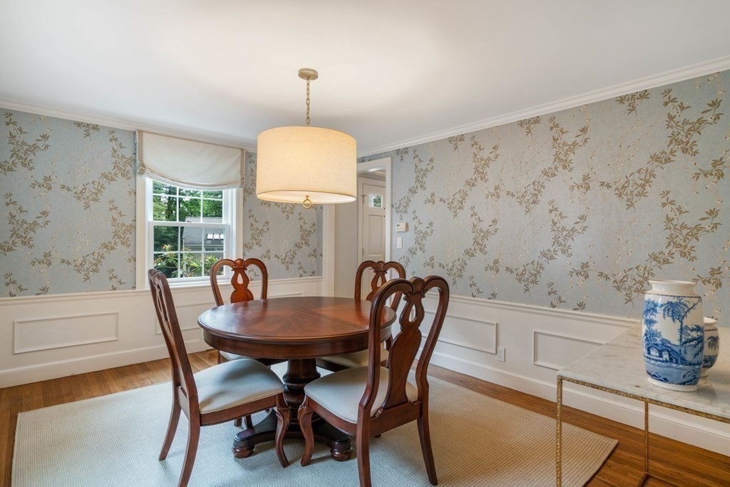 15 Woodridge Road Wellesley, MA 02482 - Photo 8 of 36 a view of a dining room with furniture and a chandelier
