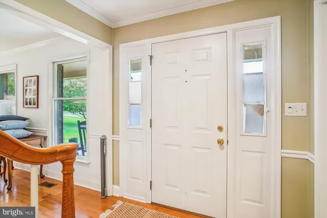 a view of an entryway with table and door