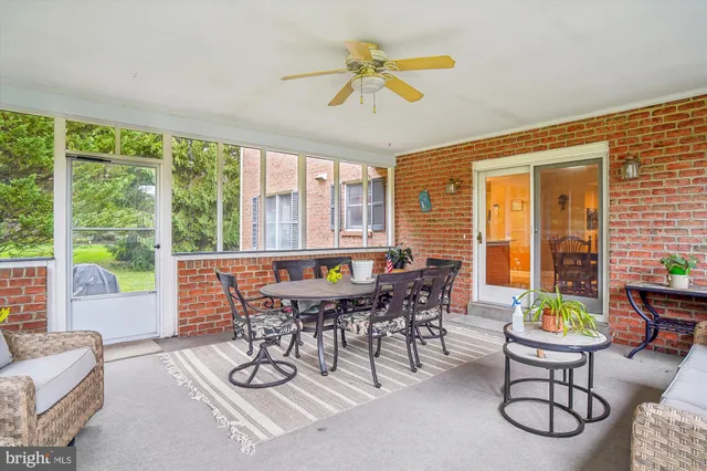 a view of a dining room with furniture window and outdoor view