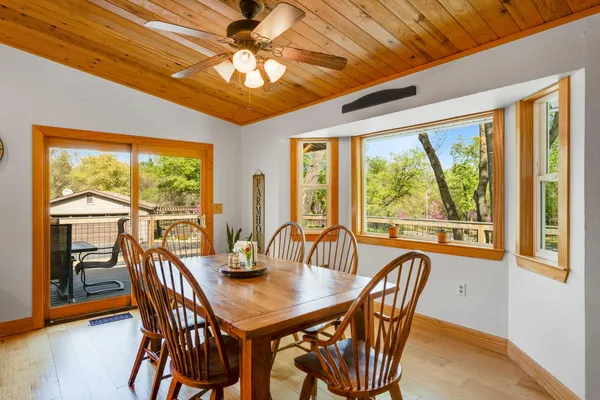 a view of a dining room with furniture window and outside view