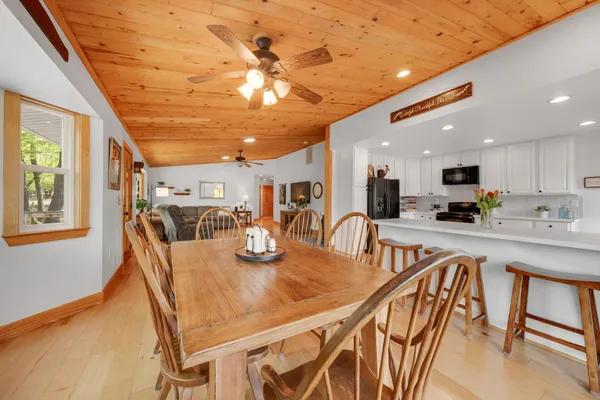 a kitchen with refrigerator and window