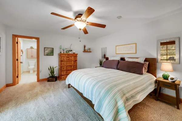 a bedroom with a large bed and a large window