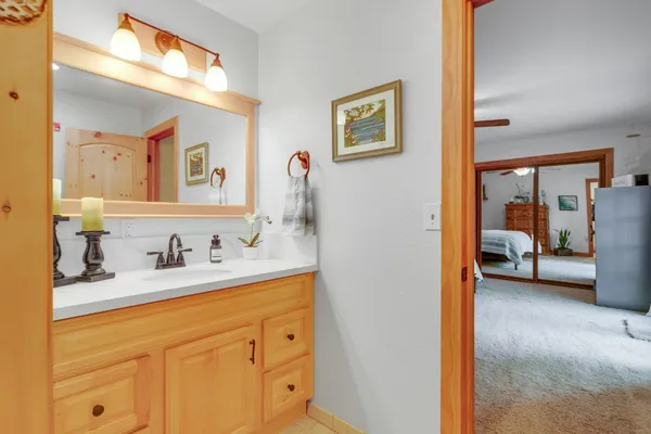 a bedroom with a bed and a lamp