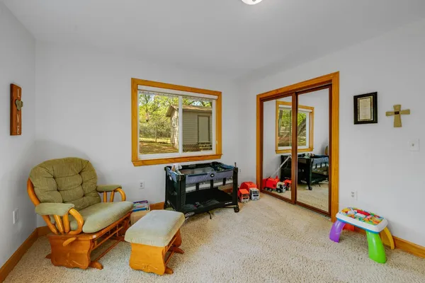 a view of a deck with chairs a barbeque with wooden floor and fence