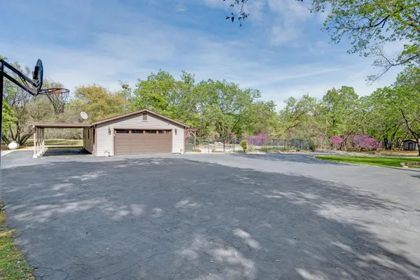 a view of a two chairs in the balcony