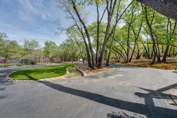 a view of a house with a patio and wooden flooring