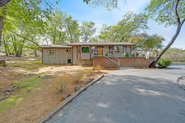 a view of deck with chairs and wooden fence