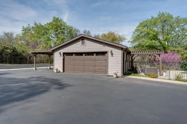 a outdoor living space with patio furniture and a fireplace