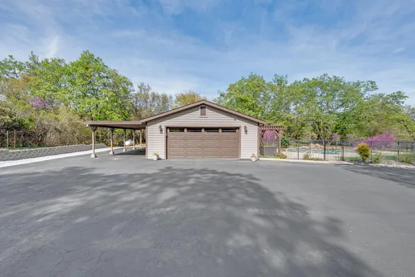 a view of yard with swimming pool and green space