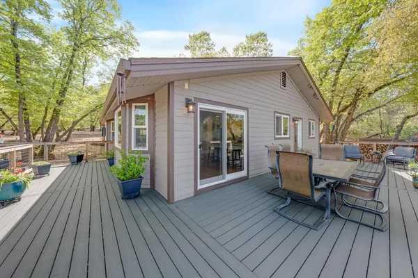 a view of a house with a tree in the background