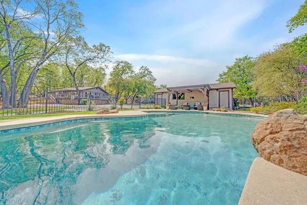 a dining room with furniture and a potted plant
