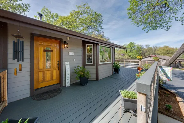 a living room with furniture ceiling fan and a rug