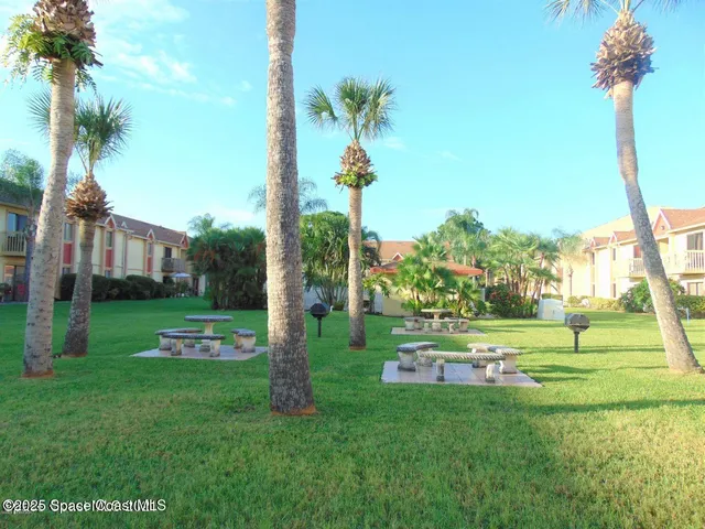a kitchen with a sink cabinets and appliances