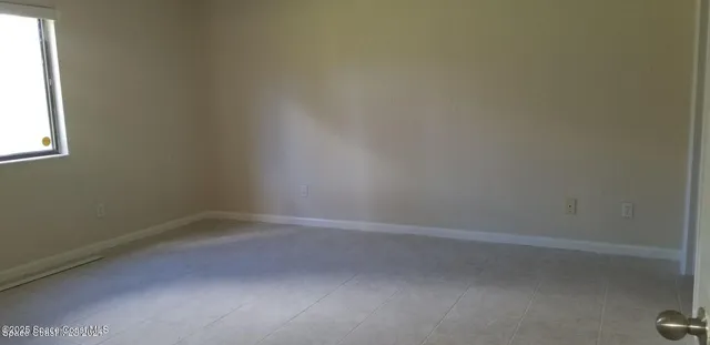 a bathroom with a granite countertop sink and mirror