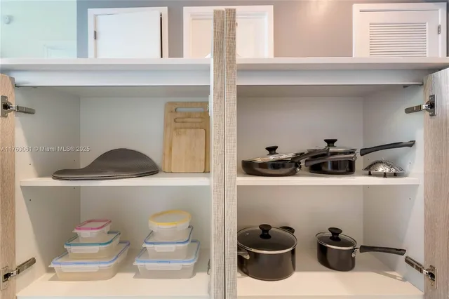 a bathroom with a sink and cabinets