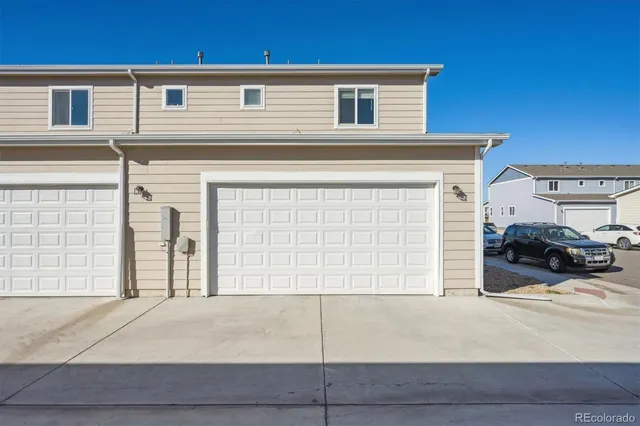 a view of a car parked front of a house
