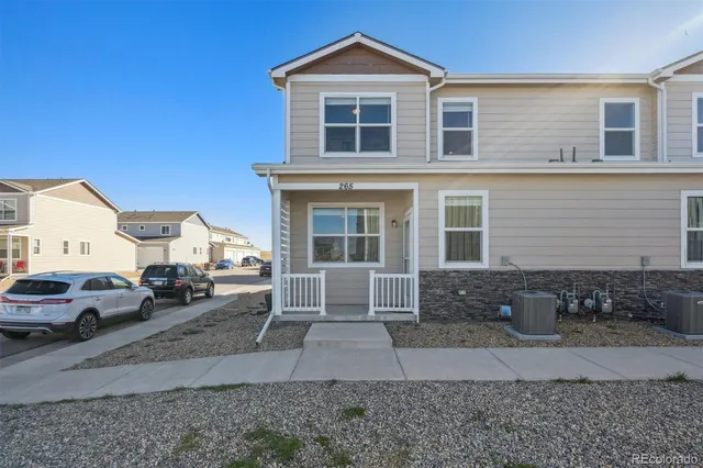 a front view of a house with parking space and parking