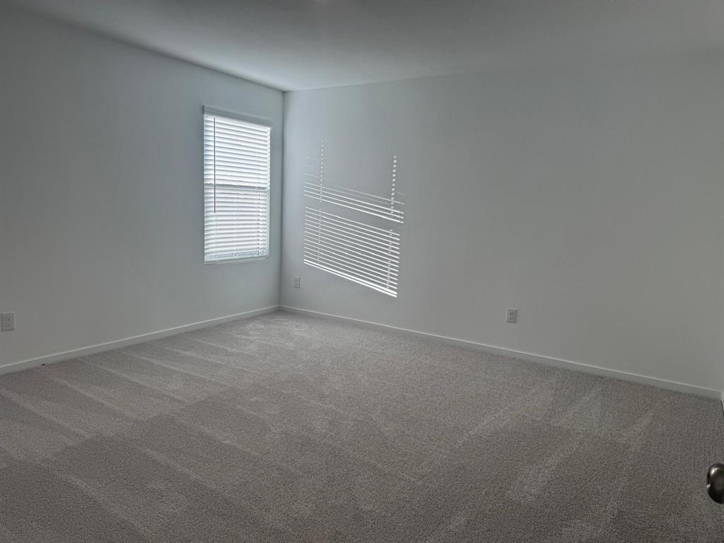 7505 Fenton Parkway Pilot Point, TX 76258 - Photo 14 of 30 an empty room with windows