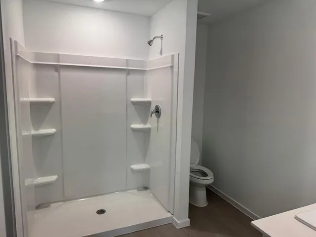 a bathroom with a toilet and a sink