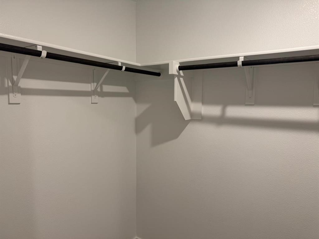 7505 Fenton Parkway Pilot Point, TX 76258 - Photo 17 of 30 a view of walk in closet