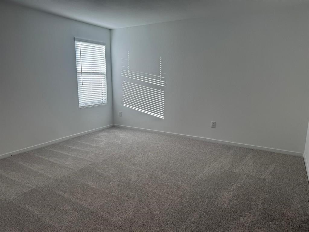 7505 Fenton Parkway Pilot Point, TX 76258 - Photo 20 of 30 an empty room with windows