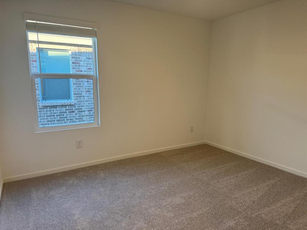 7505 Fenton Parkway Pilot Point, TX 76258 - Photo 23 of 30 an empty room with a window