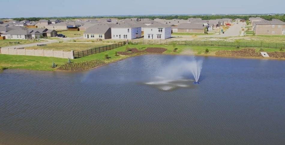 7505 Fenton Parkway Pilot Point, TX 76258 - Photo 30 of 30 view of a lake with a building in the back