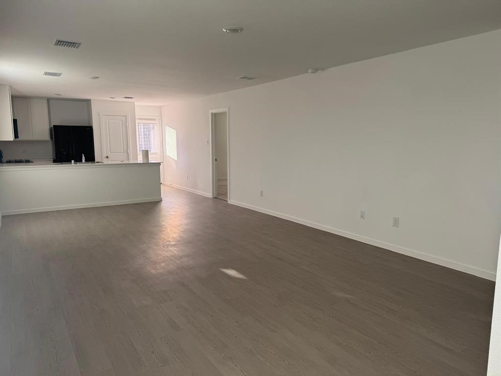 7505 Fenton Parkway Pilot Point, TX 76258 - Photo 8 of 30 a view of kitchen with kitchen island microwave and sink