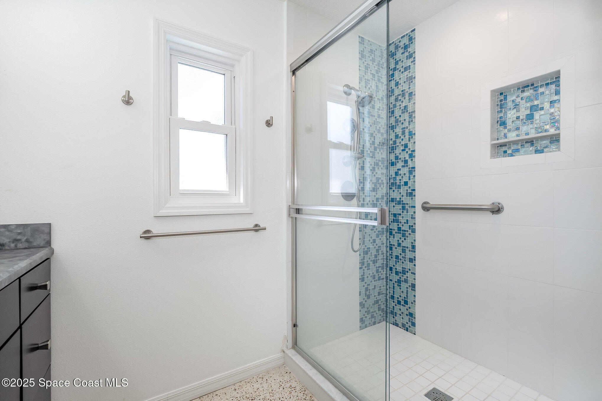 6203 Ridgewood Avenue Cocoa Beach, FL 32931 - Photo 17 of 37 a bathroom with a bathtub and shower