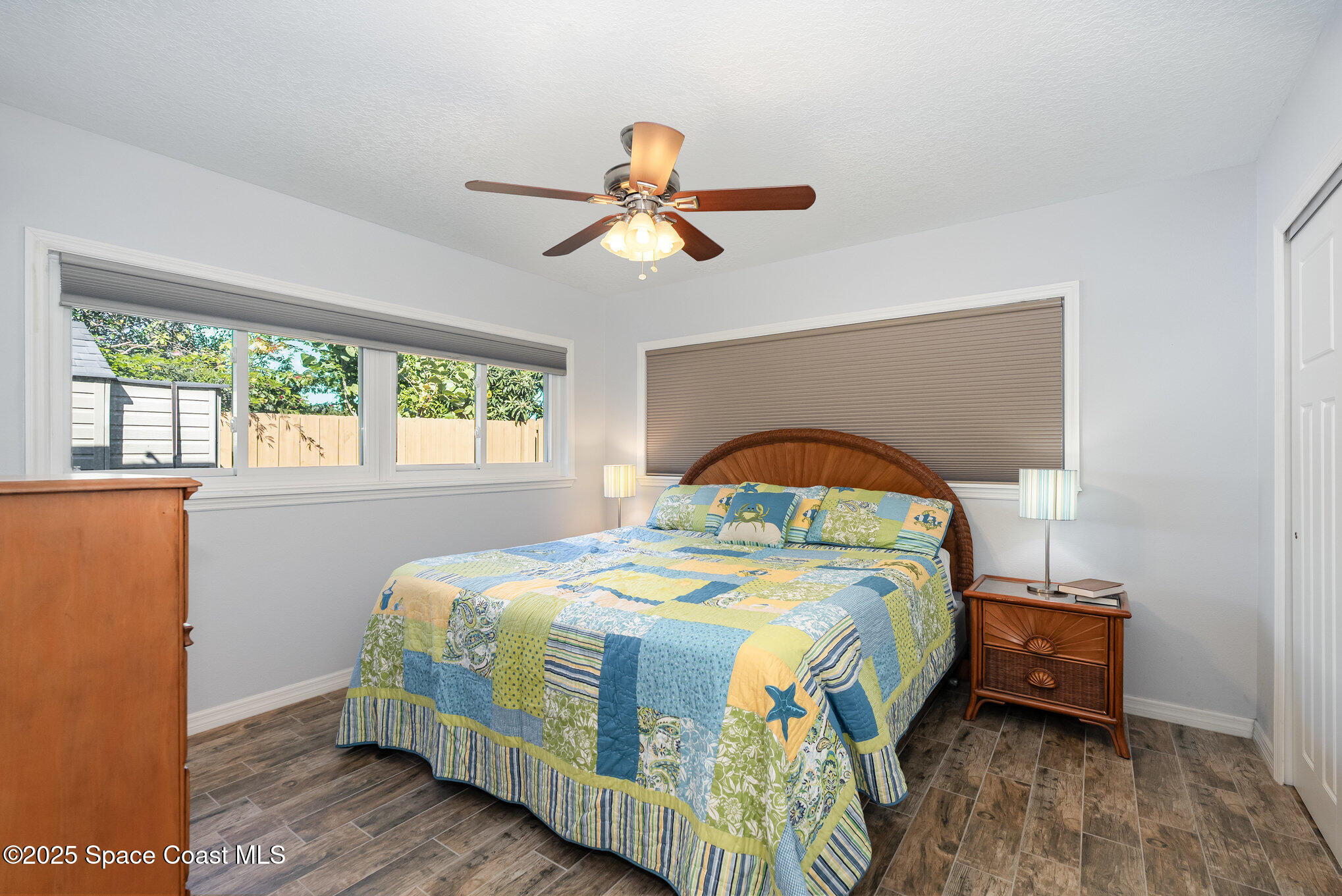 6203 Ridgewood Avenue Cocoa Beach, FL 32931 - Photo 19 of 37 a bedroom with a bed and a window