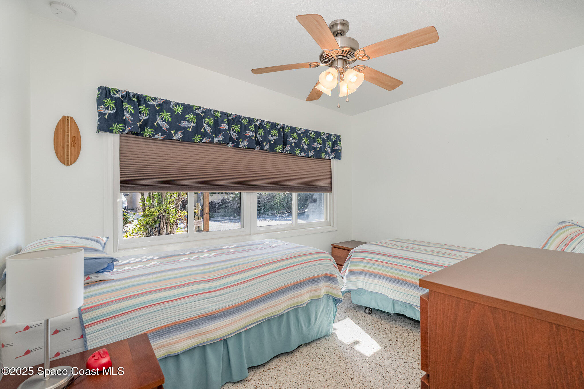 6203 Ridgewood Avenue Cocoa Beach, FL 32931 - Photo 23 of 37 a bedroom with a bed and a window