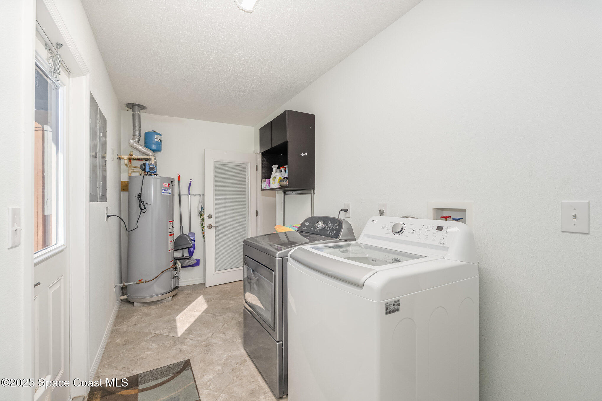 6203 Ridgewood Avenue Cocoa Beach, FL 32931 - Photo 25 of 37 a utility room with dryer and washer