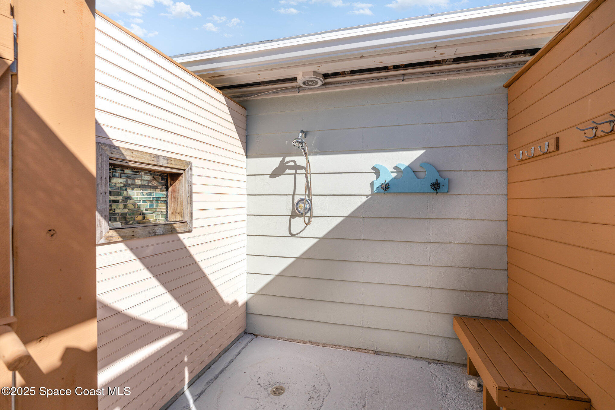 6203 Ridgewood Avenue Cocoa Beach, FL 32931 - Photo 30 of 37 a view of balcony with wooden floor and seating space