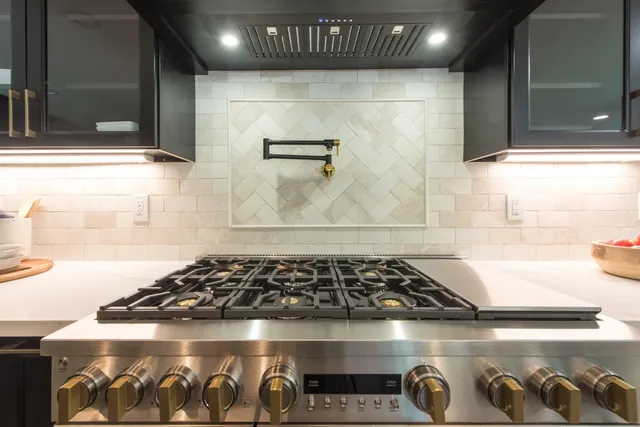 a close view of a stove a microwave and door