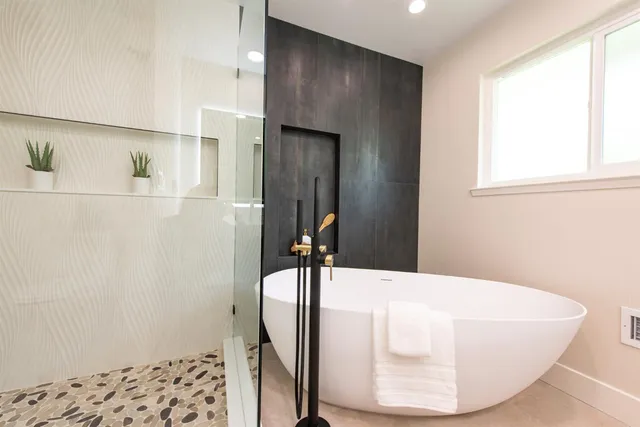 a view of a hallway with a white cabinet and a window
