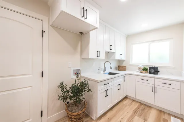 a kitchen with a sink and cabinets